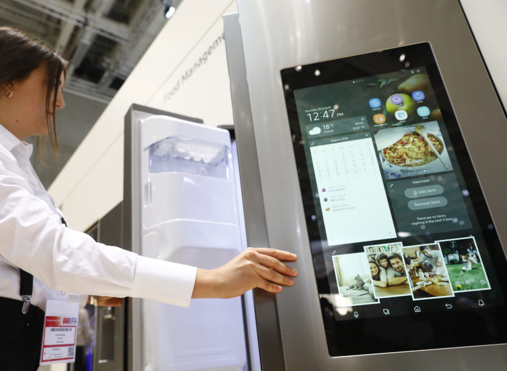 Visitors look at the Samsung Home appliance smart Fridge at the 2018 IFA consumer electronics and home appliances trade fair during the fair’s press day on August 30, 2018 in Berlin, Germany. (Photo by Michele Tantussi/Getty Images)